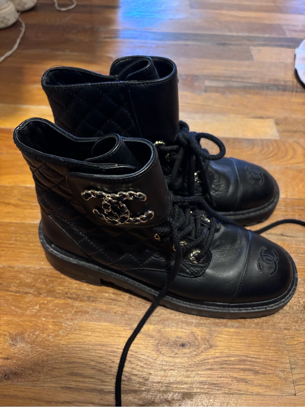 CHANEL Black Quilted Lace-Up Combat Boots with Chain CC Emblem